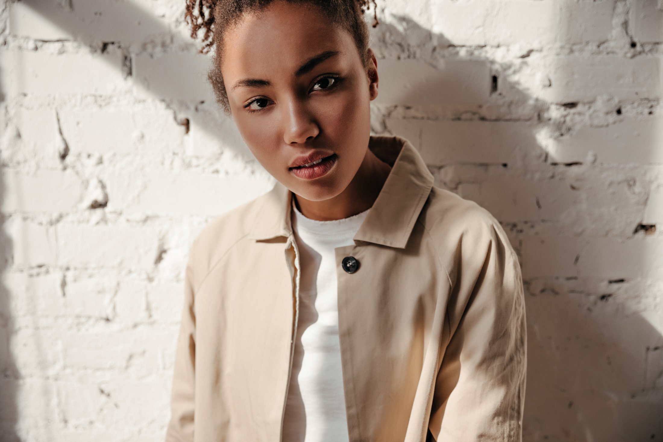 Client in a camel jacket after a styling session