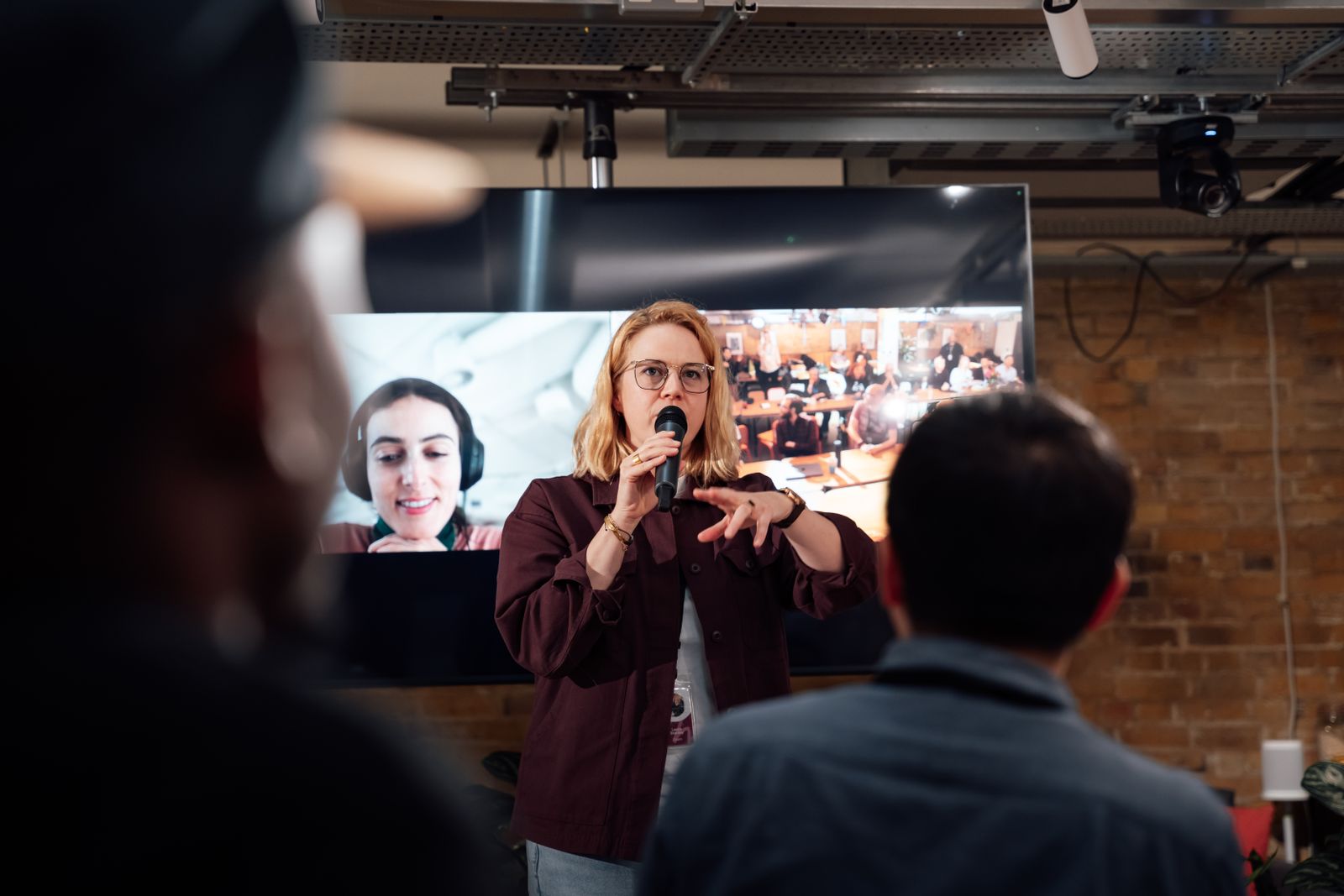 Woman speaking to an audience at a London event