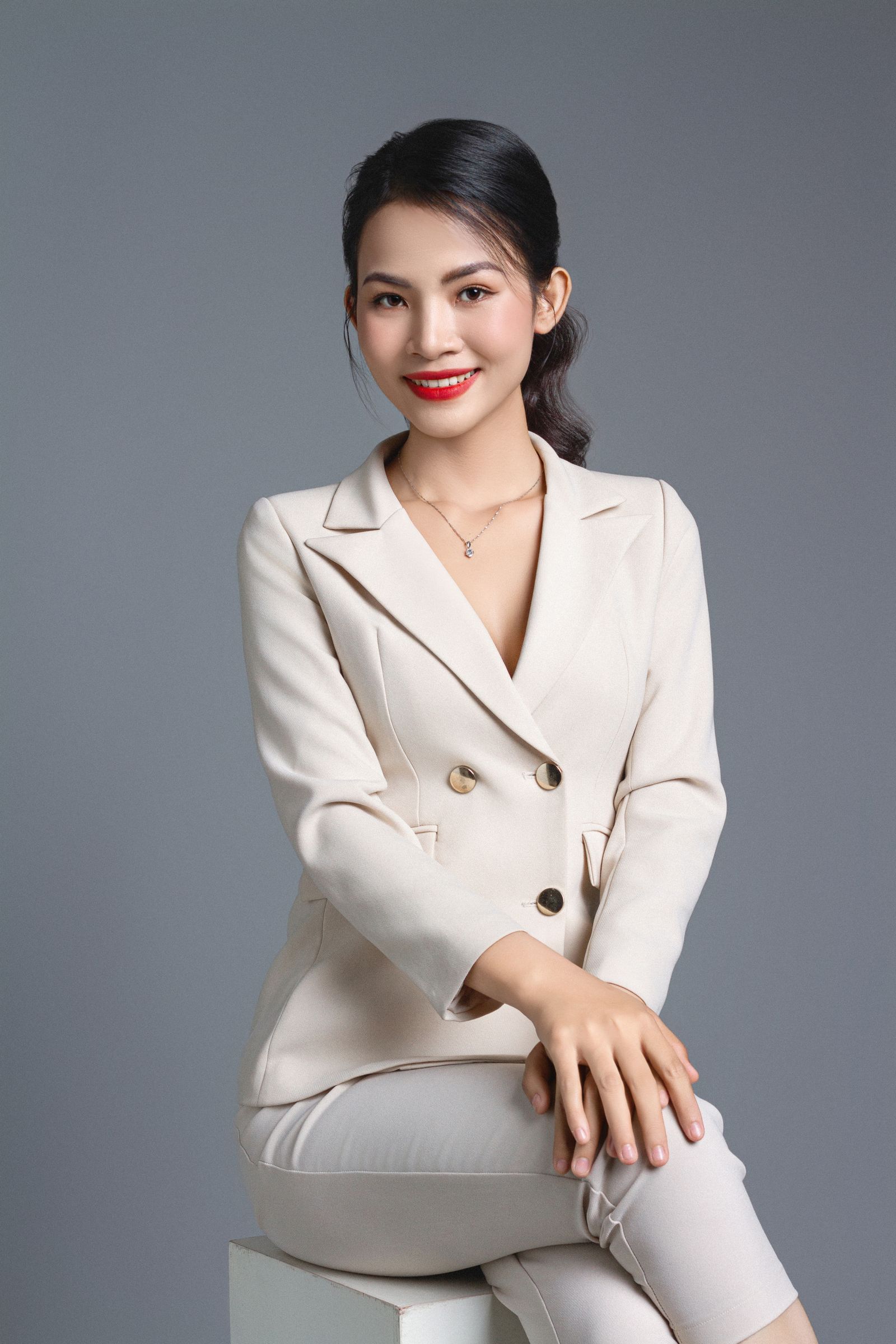 Woman in a tailored white suit
