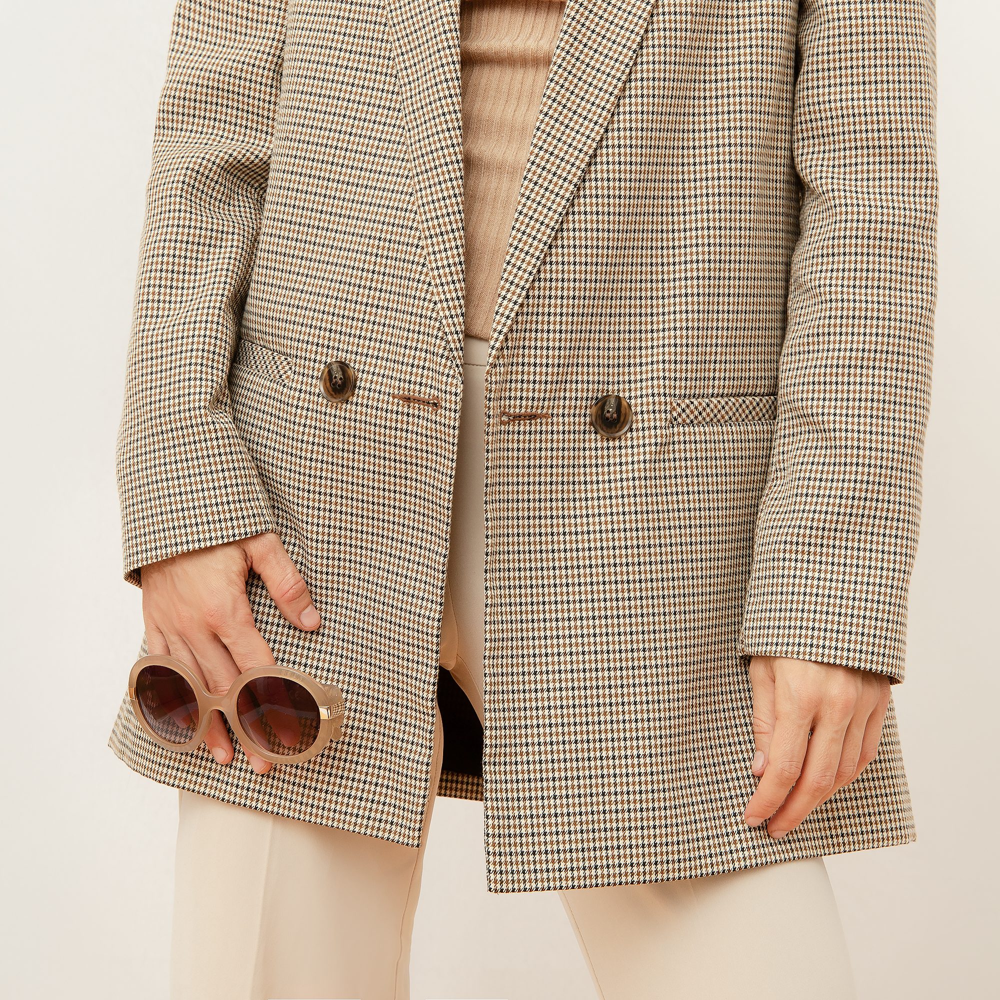 Houndstooth blazer styled with sunglasses